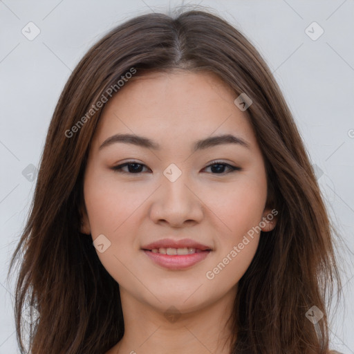 Joyful asian young-adult female with long  brown hair and brown eyes