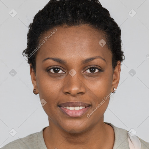 Joyful black young-adult female with short  black hair and brown eyes