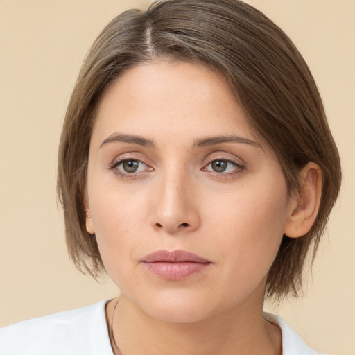 Neutral white young-adult female with medium  brown hair and brown eyes