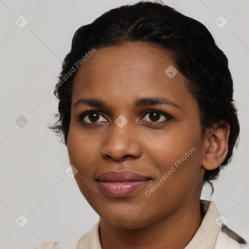 Joyful black young-adult female with short  brown hair and brown eyes