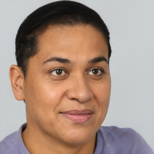 Joyful black young-adult male with short  brown hair and brown eyes