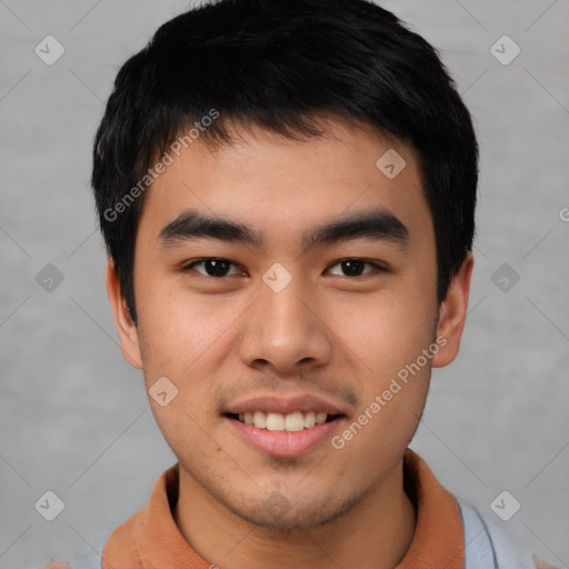 Joyful asian young-adult male with short  brown hair and brown eyes