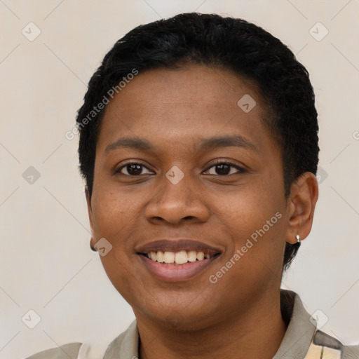 Joyful black young-adult female with short  black hair and brown eyes