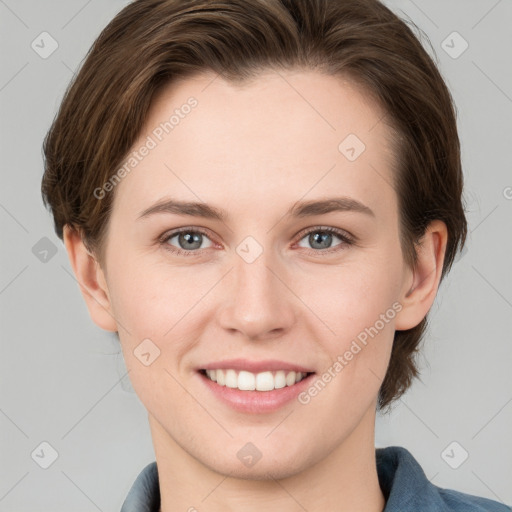 Joyful white young-adult female with medium  brown hair and grey eyes