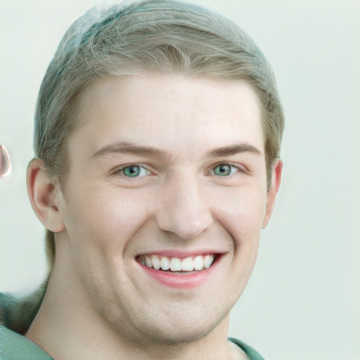 Joyful white young-adult male with short  brown hair and green eyes