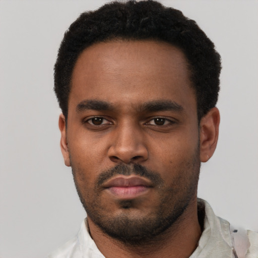 Neutral black young-adult male with short  black hair and brown eyes