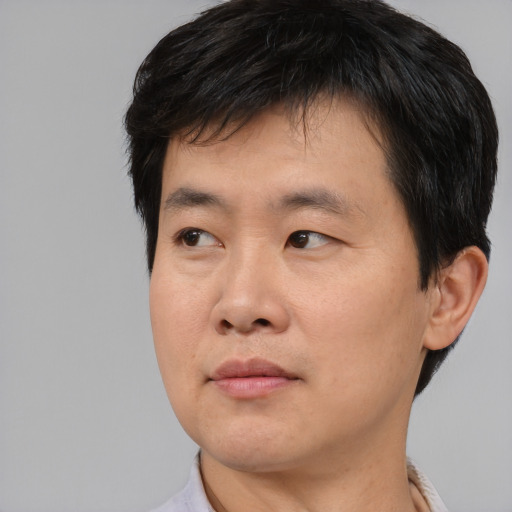 Neutral asian young-adult male with short  black hair and brown eyes