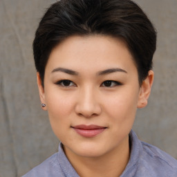 Joyful asian young-adult female with short  brown hair and brown eyes