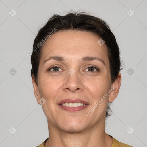 Joyful white adult female with short  brown hair and brown eyes