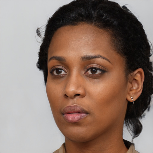 Neutral black young-adult female with medium  black hair and brown eyes
