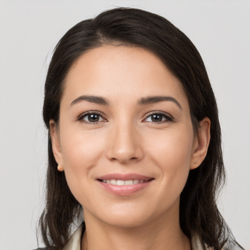 Joyful white young-adult female with medium  brown hair and brown eyes