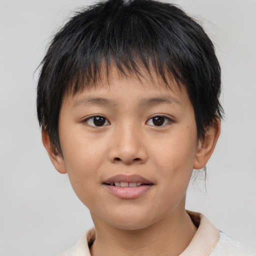 Joyful asian child female with short  brown hair and brown eyes