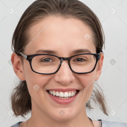 Joyful white young-adult female with medium  brown hair and grey eyes