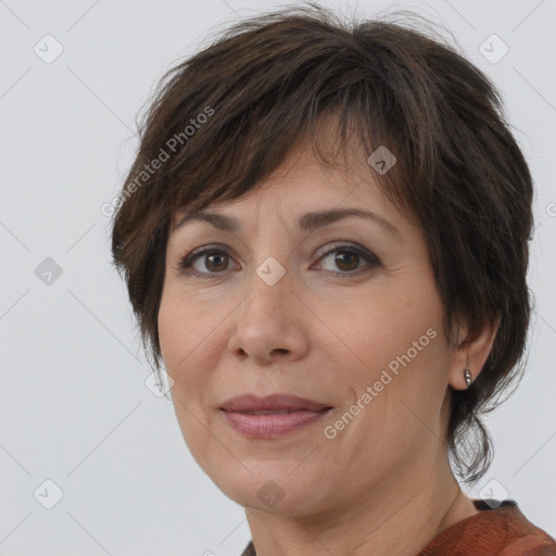 Joyful white adult female with medium  brown hair and brown eyes