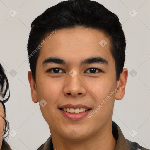 Joyful latino young-adult male with short  black hair and brown eyes