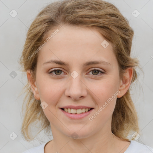 Joyful white young-adult female with medium  brown hair and blue eyes