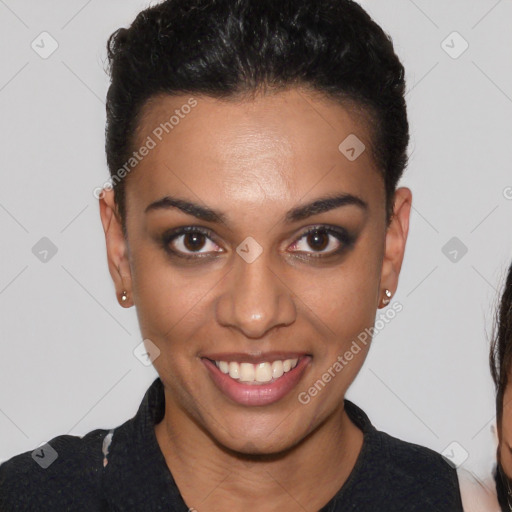 Joyful black young-adult female with short  brown hair and brown eyes