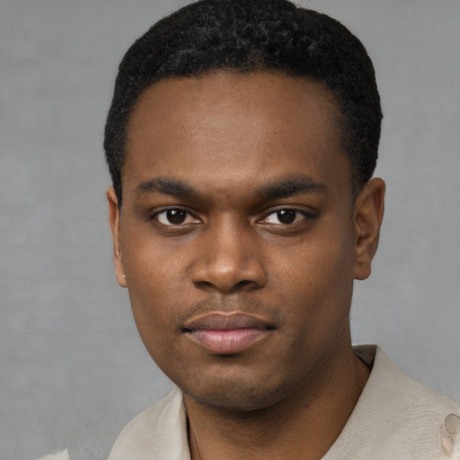 Neutral black young-adult male with short  black hair and brown eyes