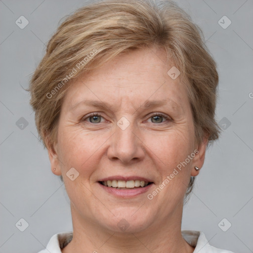 Joyful white adult female with short  brown hair and grey eyes