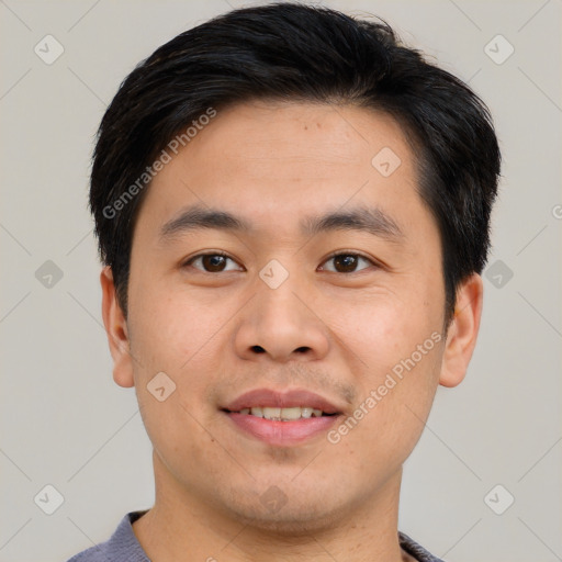 Joyful asian young-adult male with short  brown hair and brown eyes