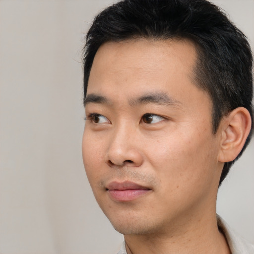 Neutral asian young-adult male with short  black hair and brown eyes