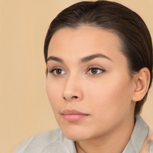 Neutral white young-adult female with medium  brown hair and brown eyes