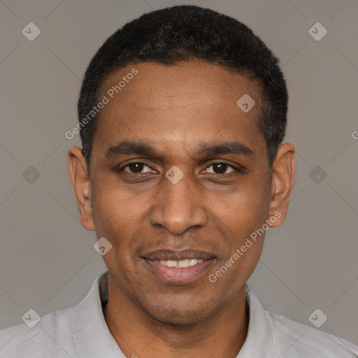 Joyful latino adult male with short  black hair and brown eyes