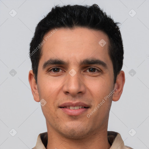 Joyful white young-adult male with short  black hair and brown eyes