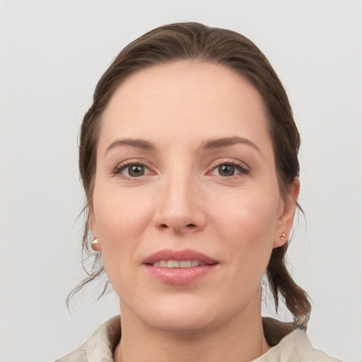 Joyful white young-adult female with medium  brown hair and brown eyes