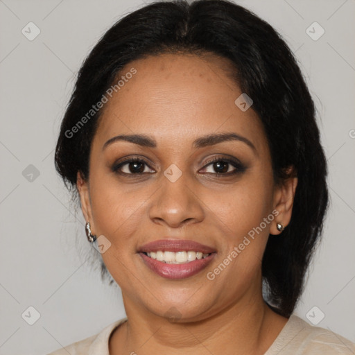 Joyful black adult female with medium  brown hair and brown eyes