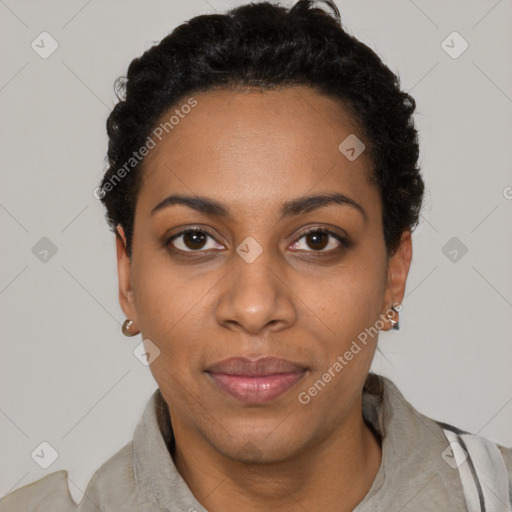 Joyful black young-adult female with short  black hair and brown eyes