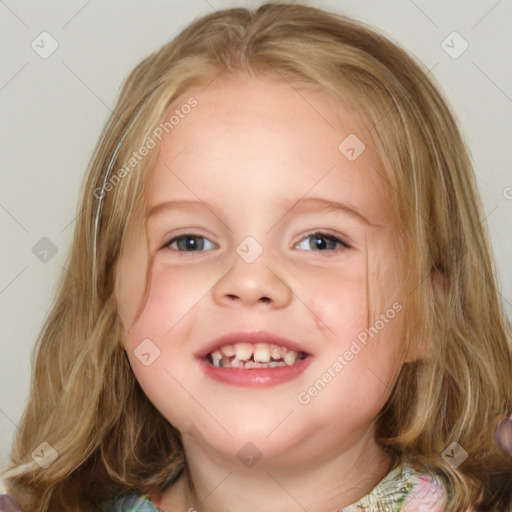 Joyful white child female with medium  brown hair and blue eyes