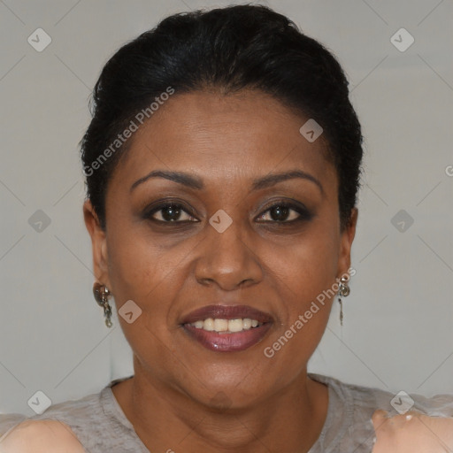 Joyful black adult female with short  brown hair and brown eyes