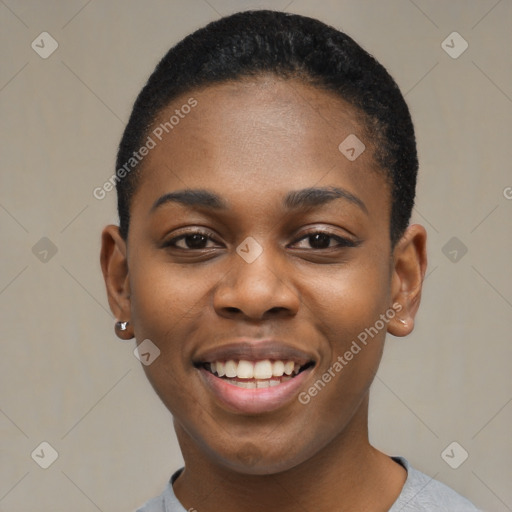 Joyful black young-adult female with short  black hair and brown eyes