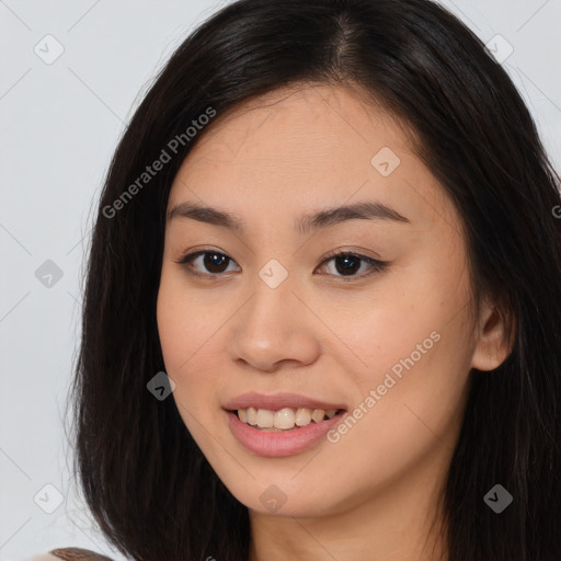 Joyful asian young-adult female with long  brown hair and brown eyes