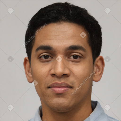 Joyful latino young-adult male with short  black hair and brown eyes