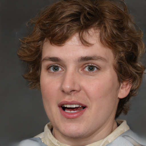 Joyful white young-adult male with medium  brown hair and blue eyes