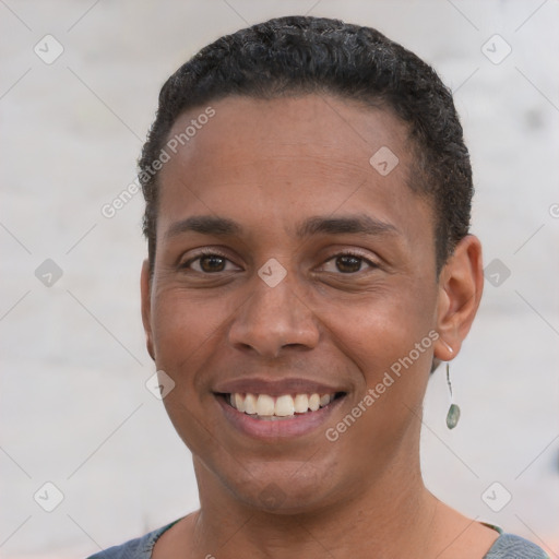 Joyful white young-adult male with short  black hair and brown eyes