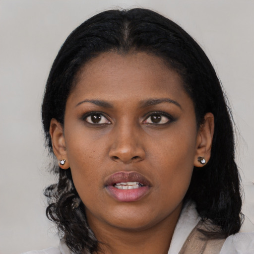 Neutral black young-adult female with medium  black hair and brown eyes