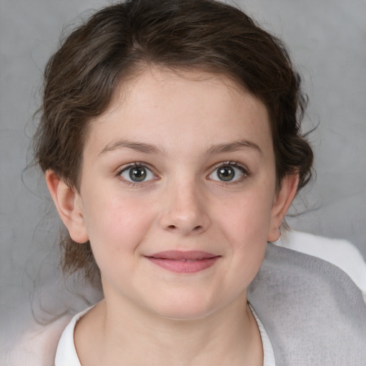 Joyful white child female with medium  brown hair and brown eyes