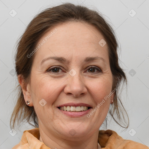 Joyful white adult female with medium  brown hair and brown eyes