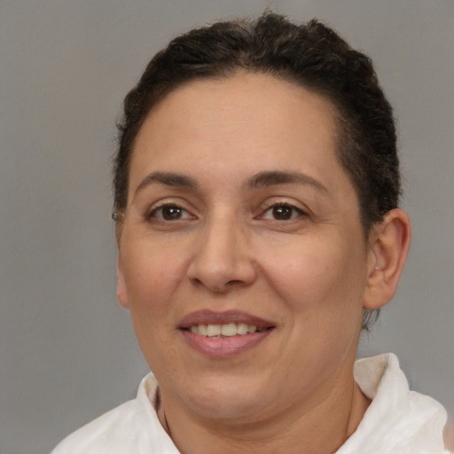 Joyful white adult female with short  brown hair and brown eyes