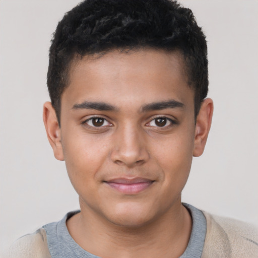 Joyful latino child male with short  brown hair and brown eyes