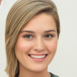 Joyful white young-adult female with long  brown hair and green eyes