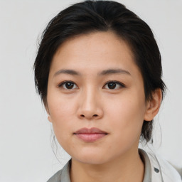 Neutral asian young-adult female with medium  brown hair and brown eyes