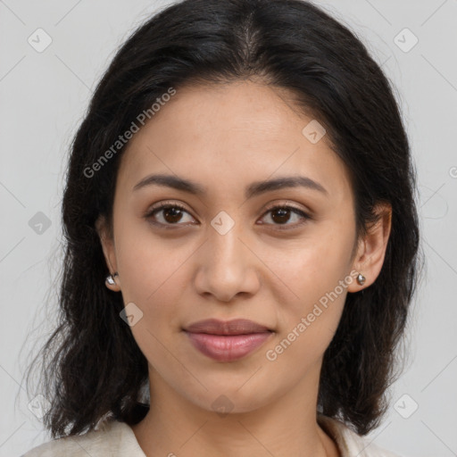 Joyful latino young-adult female with medium  brown hair and brown eyes