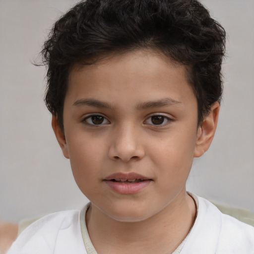 Joyful white child male with short  brown hair and brown eyes