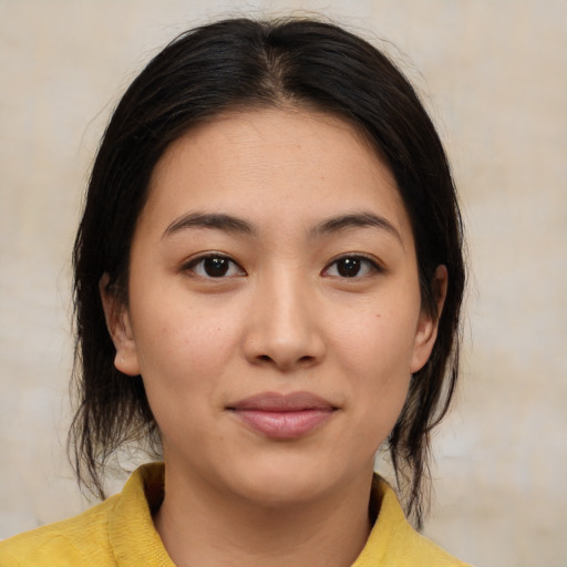 Joyful white young-adult female with medium  brown hair and brown eyes