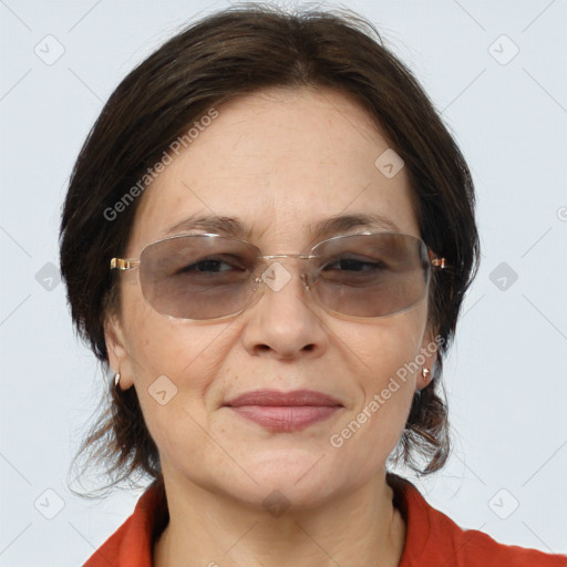 Joyful white adult female with medium  brown hair and brown eyes