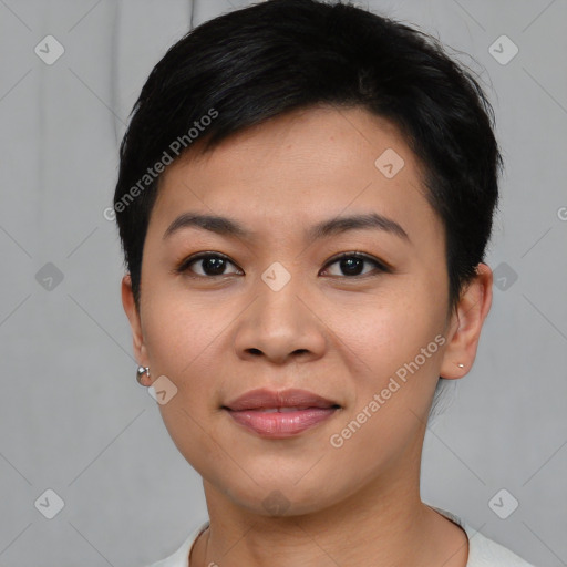 Joyful asian young-adult female with short  black hair and brown eyes